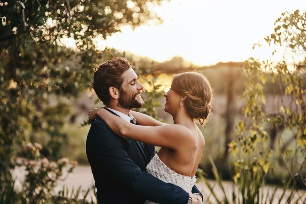 Couple sharing a moment in a sunset embrace.