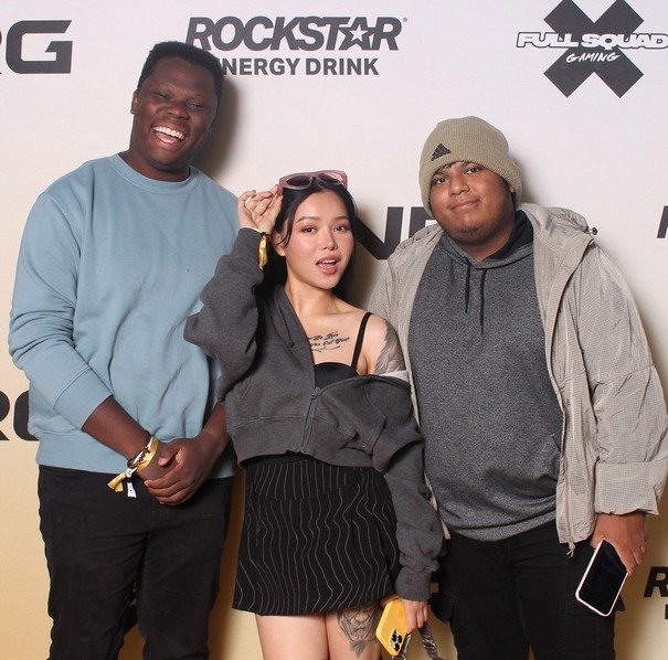 Bella Poarch and other influencers posing at NRG X Rockstar Evergy Drink.