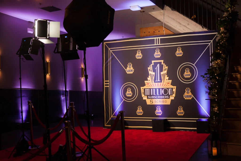 Red carpet photo booth setup for an awards-themed event.