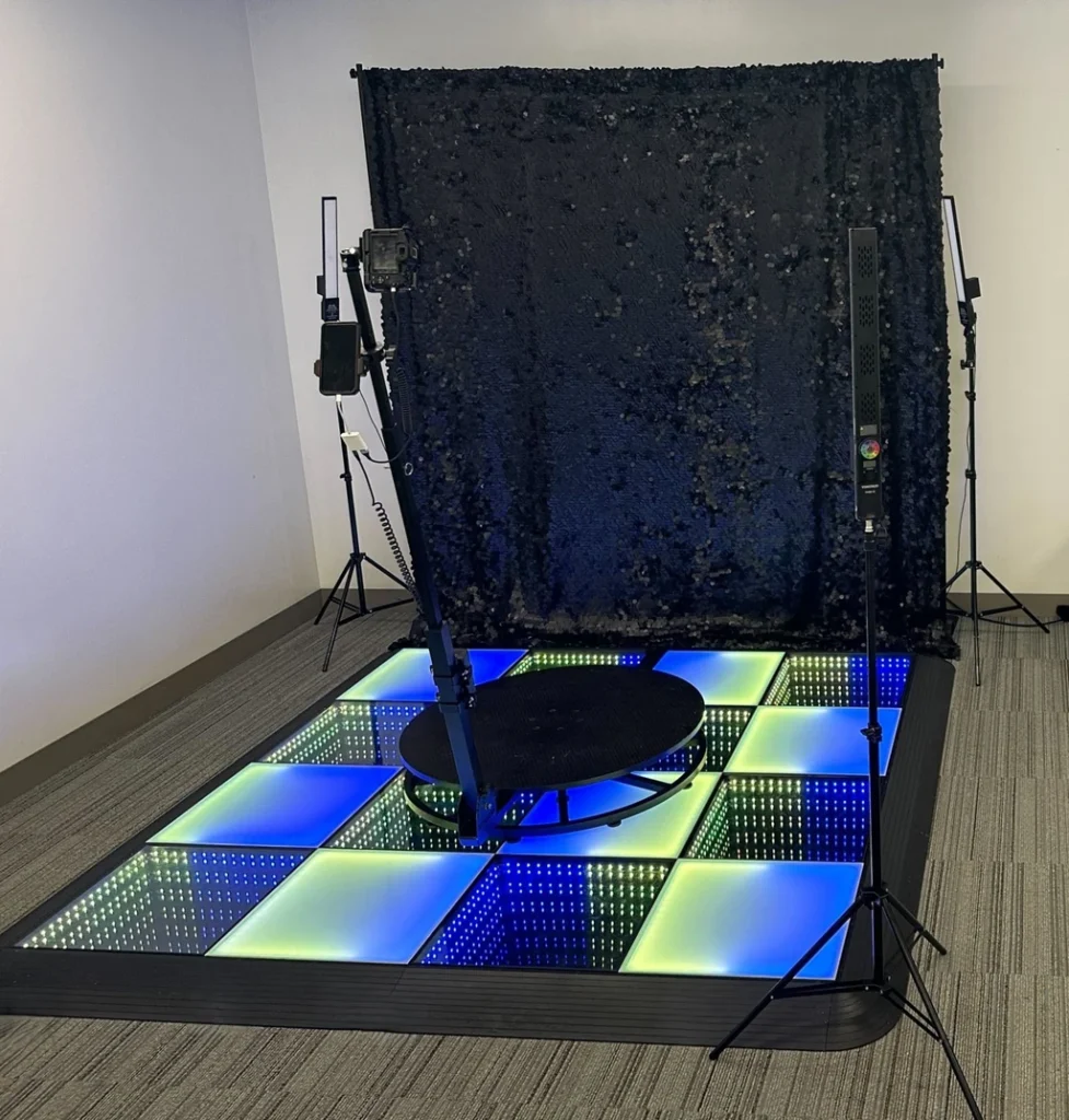 Professional 360 photo booth setup in a conference room for corporate events.