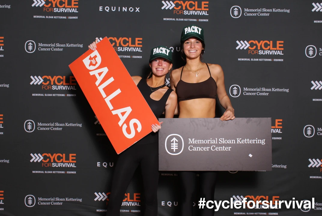 Two girls posing at Cycle for Survivial Charity Event.