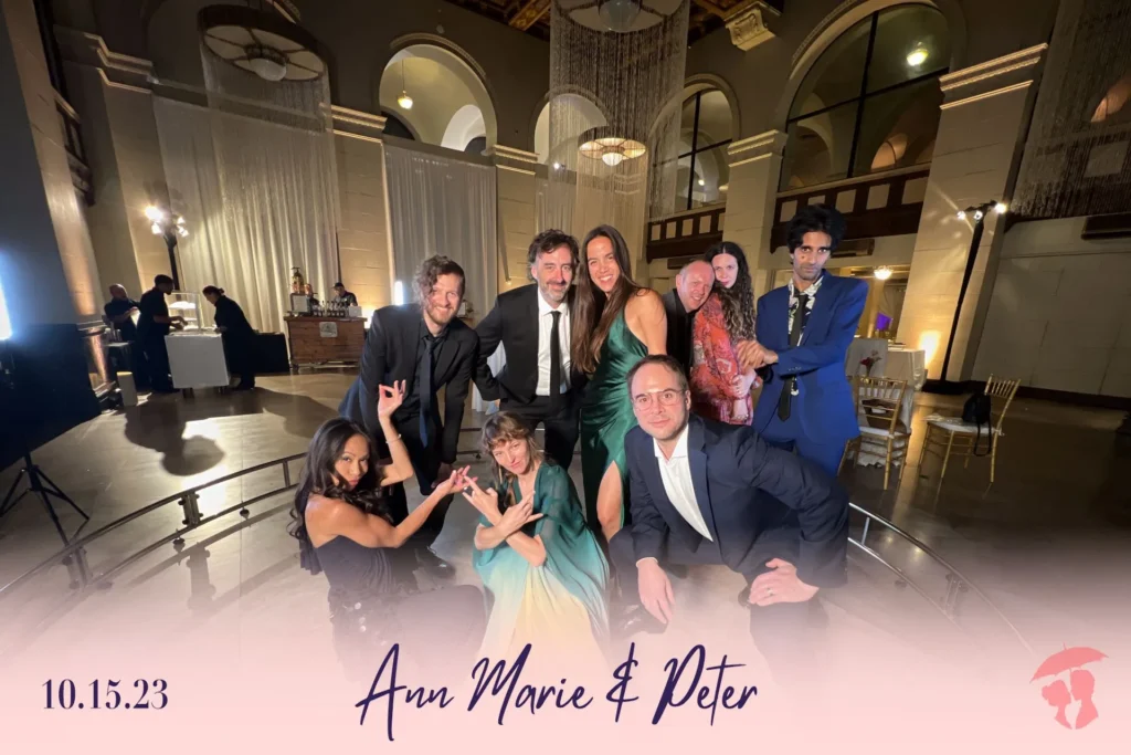 Group of guests posing at a wedding reception with 360 photo booth.