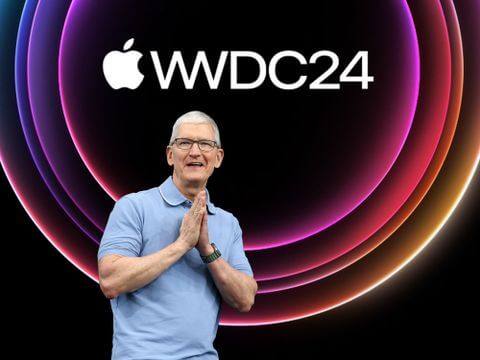 Tim Cook on stage at Apple's WWDC24 with a glowing circular background.