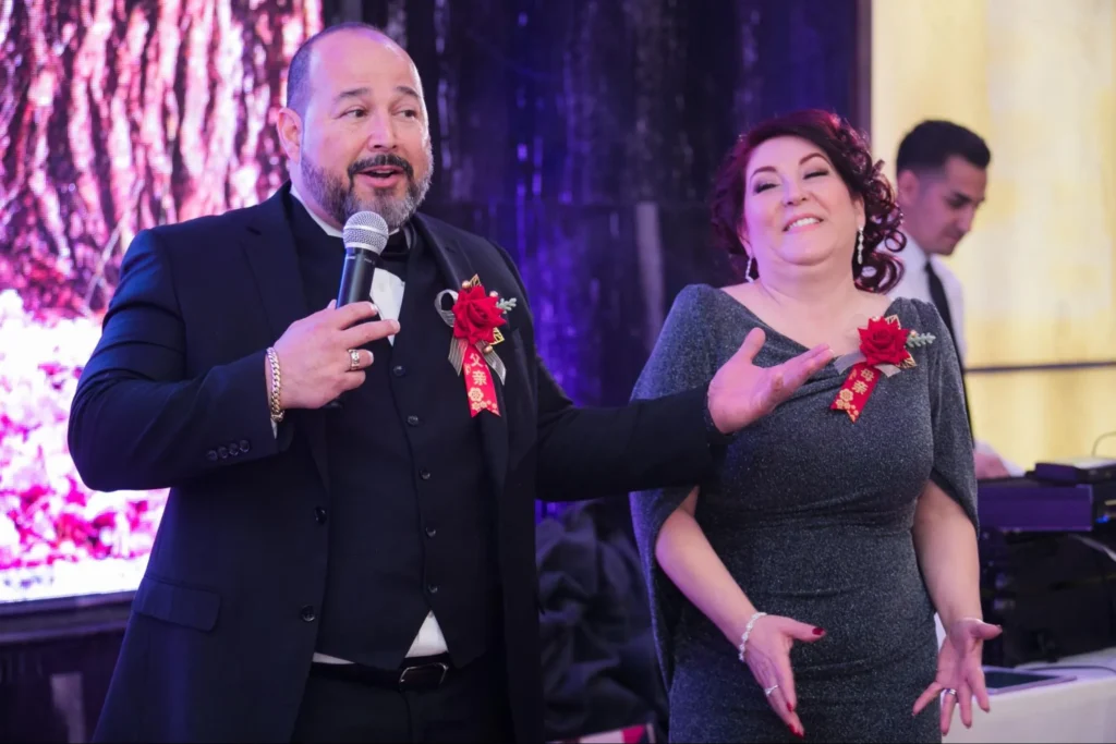 Happy couple giving a heartfelt speech at their wedding reception.