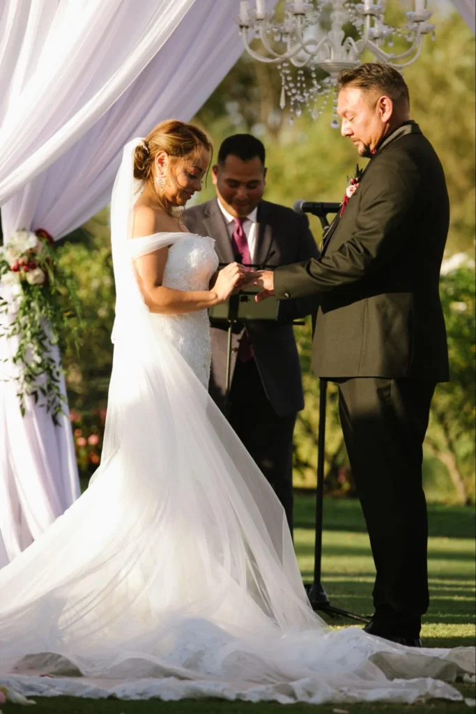 Outdoor wedding ceremony with scenic backdrop.