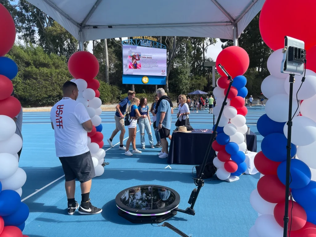 USATF  Event booth with balloon decorations at an outdoor venue