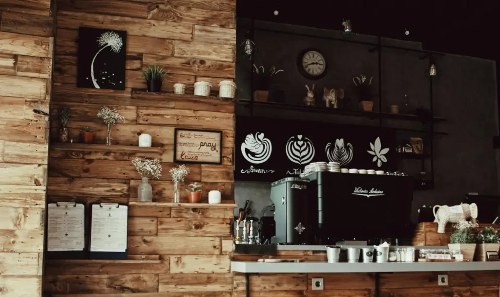 Rustic coffee shop counter with wooden paneling and latte art designs - coffee tasting or cafe-themed event setup