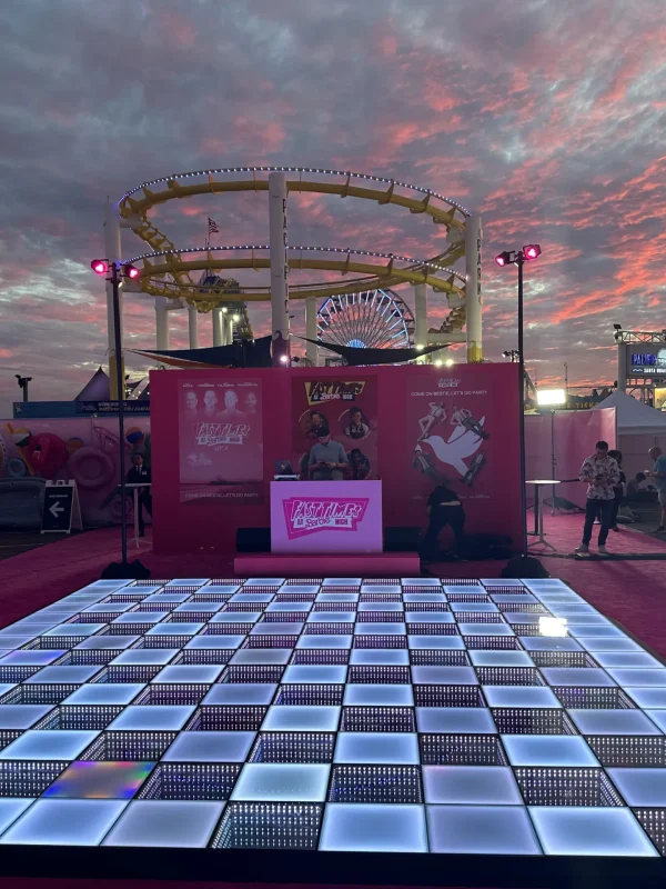 LED-lit dance floor at an outdoor sunset event